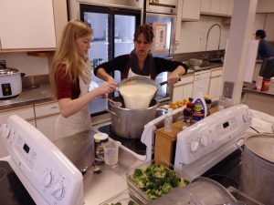 Student Jennie Humphrey and teacher Lily Boron prepare cheese sauce. 