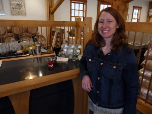 Port Chilkoot Distillery owner and distiller Heather Shade stands at the bar of the tasting room.