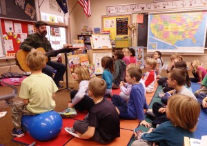 Music teacher James Baldwin sings with first and second graders. (Emily Files)