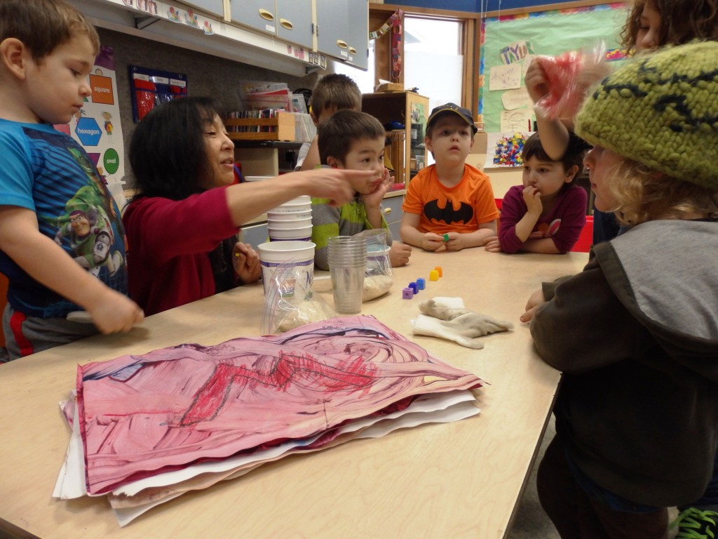 Jeanne Kitayama teaches preschoolers about colors with food coloring and rice. (Emily Files)