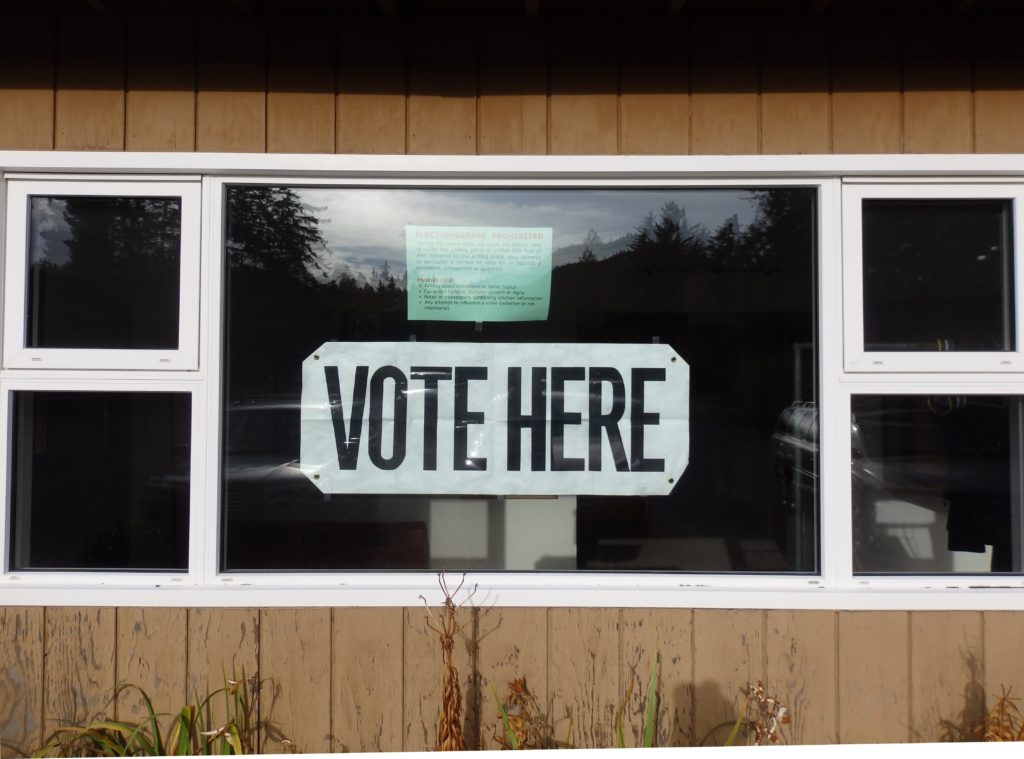 A sign hangs in the window of the Chilkat Center during the 2016 Haines municipal election. (Emily Files)