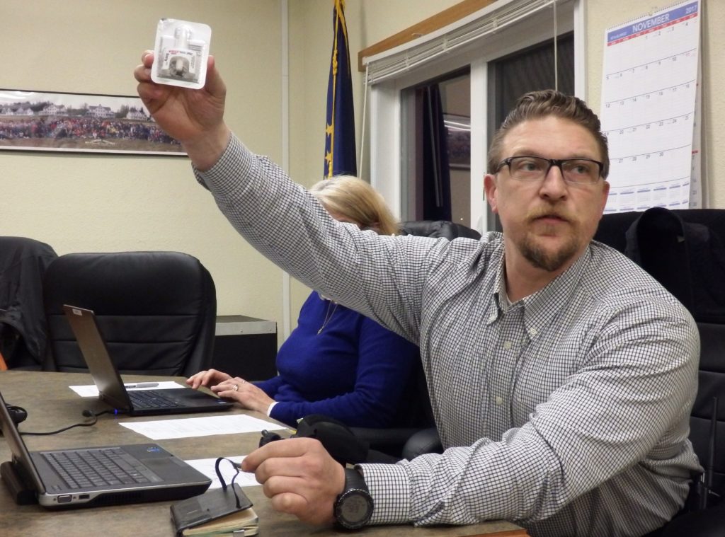 Haines Police Chief Heath Scott holds up the Narcan nasal spray he carries with him. Narcan is used to counteract opioid overdoses. (Emily Files)